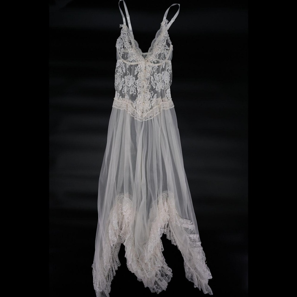 White sheer lingerie gown has a floral lace bodice with a deep V-neckline